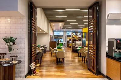 a restaurant with tables and chairs in a room at Holiday Inn Sisli by IHG in Istanbul