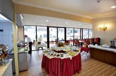 a kitchen with a table with plates of food on it at Amber Hotel & Spa in Istanbul
