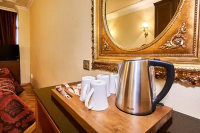 a tea kettle on a table in a hotel room at Amber Hotel & Spa in Istanbul