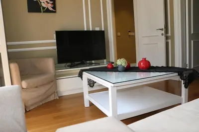 a living room with a coffee table and a television at Triada Hotel Taksim - Special Category in Istanbul
