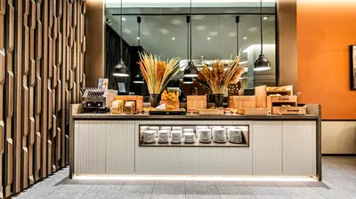 a store front with a counter with boxes on it at Lamartine Hotel in Istanbul
