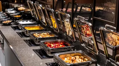 a buffet line with many trays of food at Lamartine Hotel in Istanbul