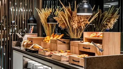 a bakery counter with boxes of bread and pastries at Lamartine Hotel in Istanbul