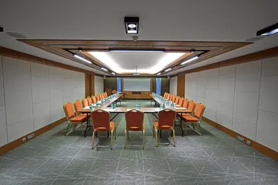 a conference room with a long table and chairs at Lamartine Hotel in Istanbul