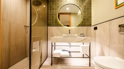 a bathroom with a sink and a mirror at Lamartine Hotel in Istanbul