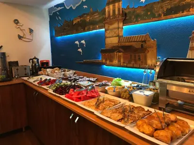 a buffet with many different types of food on a counter at Sphendon Hotel in Istanbul