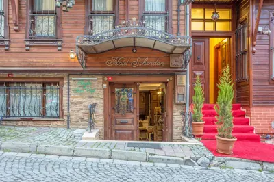 an entrance to a building with a red carpet at Sphendon Hotel in Istanbul