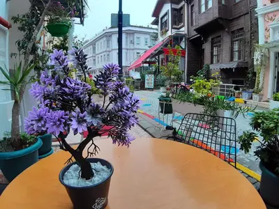 a table with purple flowers on top of it at Oceans 7 Hotel in Istanbul