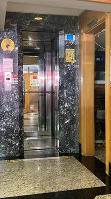 a elevator in a building with marble walls at Park Star Hotel Taksim in Istanbul