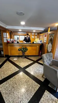 a man standing at a bar in a restaurant at Park Star Hotel Taksim in Istanbul