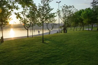 a park with trees and a body of water at Hotel Troya Balat in Istanbul