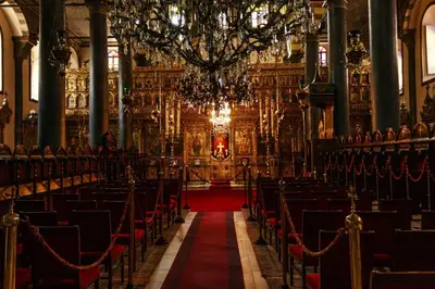 an empty church with chairs and a red carpet at Hotel Troya Balat in Istanbul