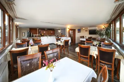 a dining room with tables and chairs in a restaurant at Aldem Hotel in Istanbul