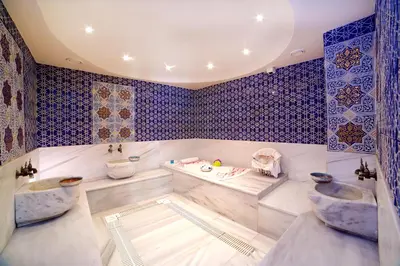 a bathroom with two sinks and blue tiles at Zagreb Hotel in Istanbul