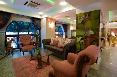 a living room with a couch and chairs and a table at Zagreb Hotel in Istanbul