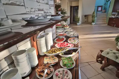 a buffet line with plates and bowls of food at Artefes Hotel Old City in Istanbul