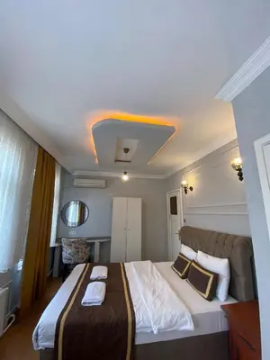 a bedroom with a large bed in a room at Berce Apartments in Istanbul