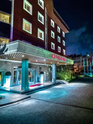 a large building with a sign in front of it at Agaoğlu My City Hotel Istanbul in Istanbul