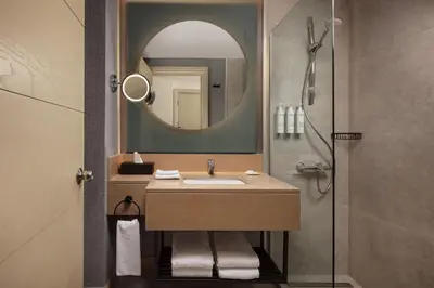 a bathroom with a sink and a mirror at Delta Hotels Istanbul West in Istanbul
