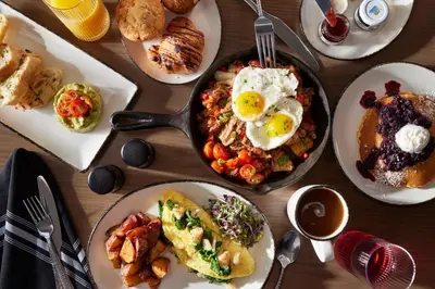 a table topped with plates of breakfast food with eggs at Delta Hotels Istanbul West in Istanbul