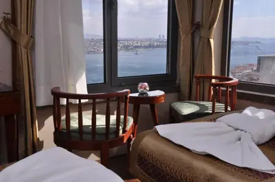 a hotel room with two beds and a view of the water at Taksim Star Hotel in Istanbul