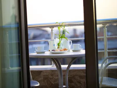 a table with a plate of food on a balcony at Taksim Star Hotel in Istanbul