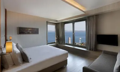 a hotel room with a bed and a large window at Hotel Arcadia Blue Istanbul in Istanbul