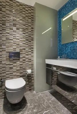 a bathroom with a toilet and a sink and a mirror at Hotel Arcadia Blue Istanbul in Istanbul