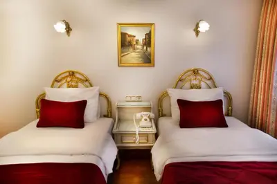 two beds sitting next to each other in a room at Valide Sultan Konagi in Istanbul