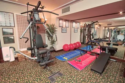 a gym with several treadmills and exercise equipment at Germir Palas Hotel - Special Class in Istanbul