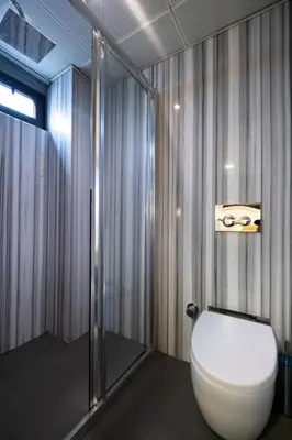 a bathroom with a toilet and a shower at The Pera Hotel in Istanbul