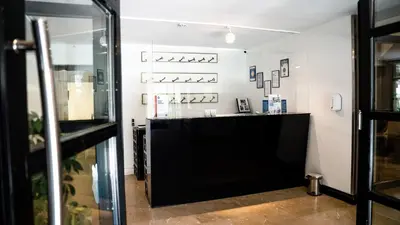 a shop with a black counter in a room at The Marmara Suadiye Residence in Istanbul