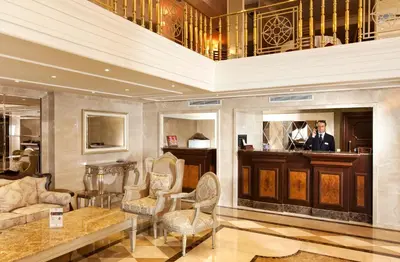a man standing in a lobby with a organ at Grand Halic Goldenhorn in Istanbul