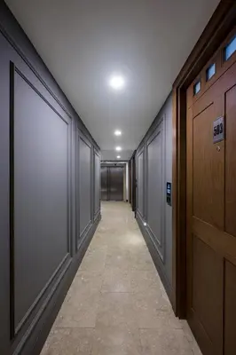 an empty hallway with a row of glass doors at Continental Hotel Pera in Istanbul