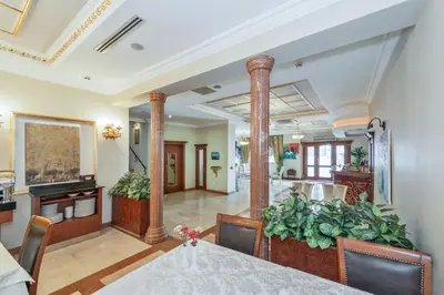 a dining room with a table and some plants at Antis Hotel-Special Category in Istanbul