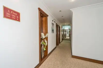 a hallway in a hospital with a sign on the wall at Antis Hotel-Special Category in Istanbul