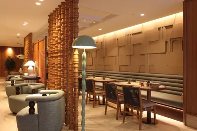 a restaurant with tables and chairs and a pillar at Housez Suites & Apartments Special Class in Istanbul