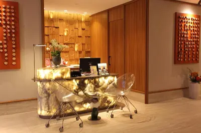 a lobby with a desk and chairs in a room at Housez Suites & Apartments Special Class in Istanbul