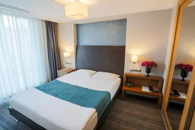 a bedroom with a large bed in a hotel room at Housez Suites & Apartments Special Class in Istanbul
