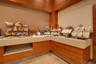 a bakery counter with a lot of food at Baia Bursa Hotel in Bursa
