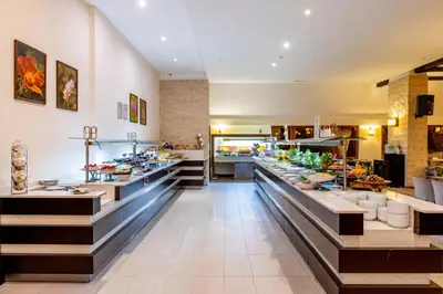 a restaurant with a buffet line with food at Monte Baia Uludağ in Uludag