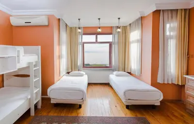 a bedroom with two bunk beds and a window at Bucoleon by Cheers in Istanbul