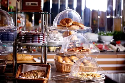 a display of different types of pastries in glass containers at Aspen Hotel & SPA Istanbul Old City in Istanbul