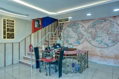 a room with a staircase and a table with a table sidx sidx at Fors Hotel in Istanbul