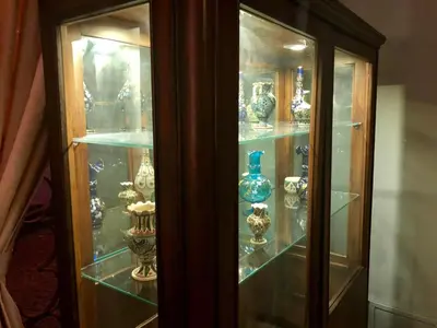 a glass cabinet filled with vases on display at Hotel Fehmi Bey - Special Category in Istanbul