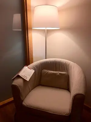 a chair in a hotel room with a lamp at Hotel Fehmi Bey - Special Category in Istanbul