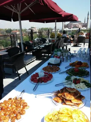 a table with plates of food on top of a roof at Agora Life Hotel - Special Class in Istanbul