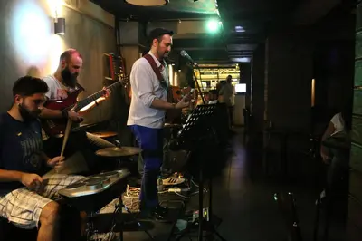 a group of men playing instruments in a room at Kuzen Otel in Istanbul