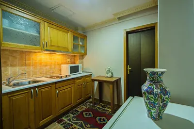 a kitchen with a vase in the corner of a room at Apart Hotel Hippodrome in Istanbul