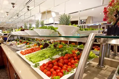 a buffet line with fruits and vegetables on display at Mosaic Hotel Old City -Special Category in Istanbul